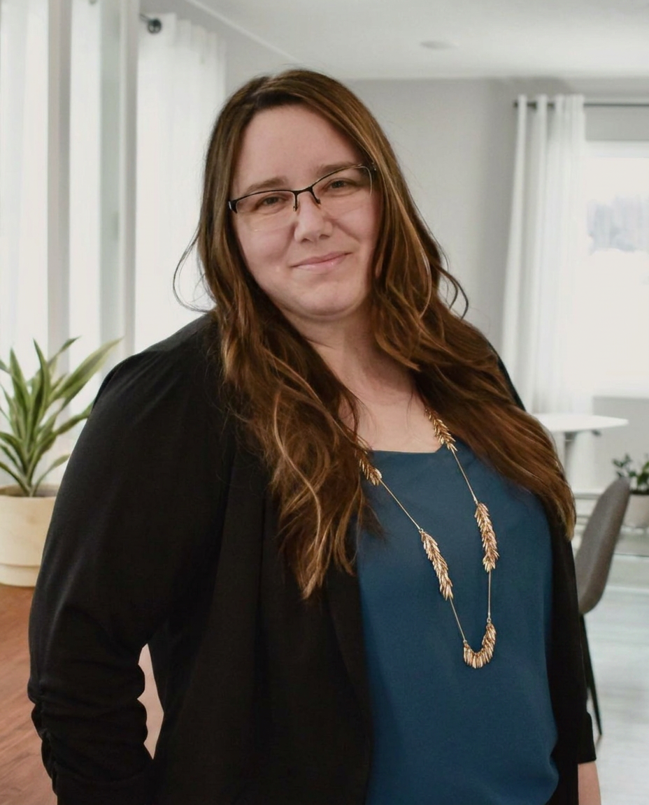 Robin Angaiak, owner of Line & Ledger, standing in her Alaska office
